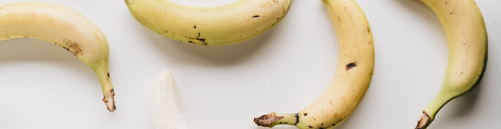 Bananas on a white surface